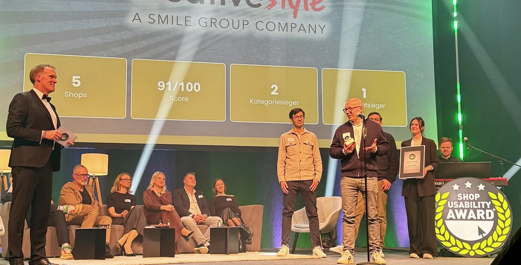 People on stage during an award ceremony, with a large screen displaying "creative style - Agentur des Jahres."