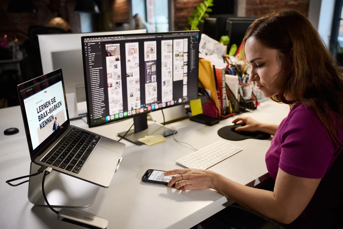 UX designer reviewing career website layout on desktop screen