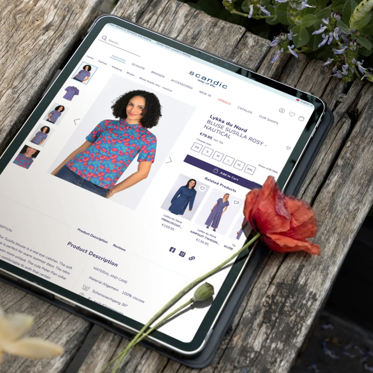 Scandic Way of Life e-commerce product page on a tablet showcasing a floral blouse next to a poppy flower