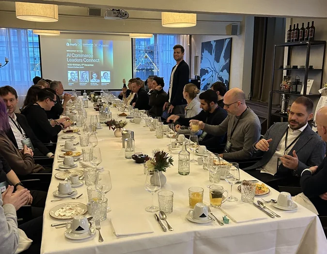 Large group of professionals attending the "AI Commerce Leaders Connect" breakfast event by Shopify, creative style, and mparticle