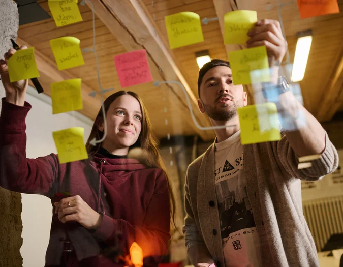 Team brainstorming with sticky notes