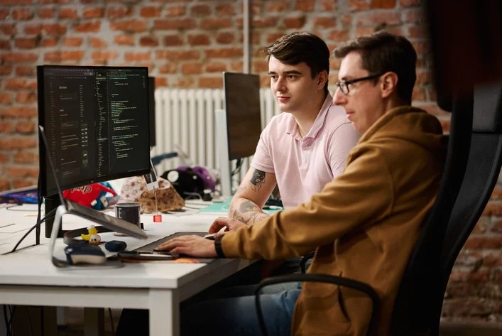 Developers building and optimizing e-commerce platform code