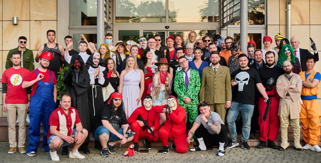 The team in colorful party costumes