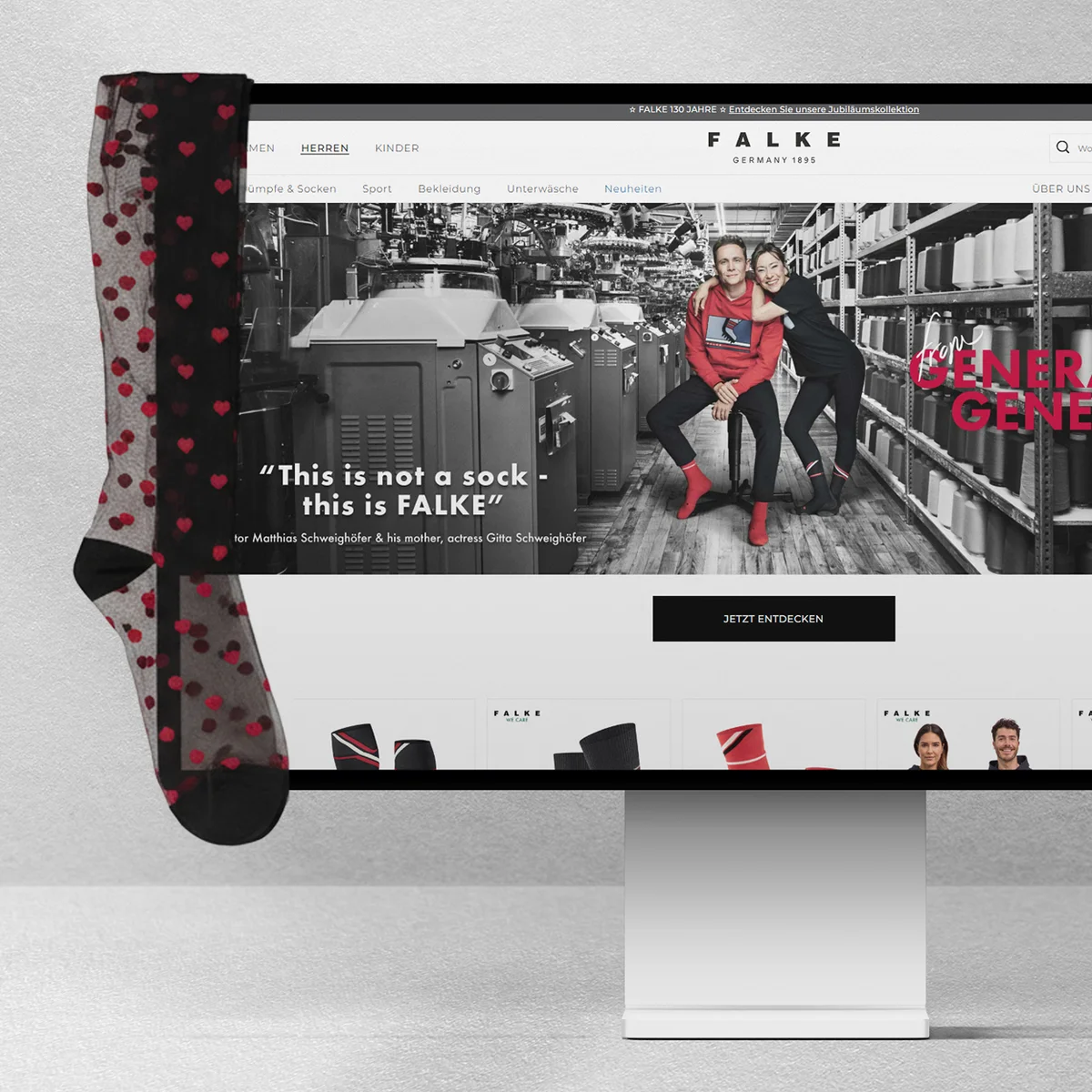 FALKE e-commerce website preview on a desktop monitor featuring the "This is not a sock - this is FALKE" campaign with actor Matthias Schweighöfer, set against a factory background with a sheer patterned sock draped over the side of the screen